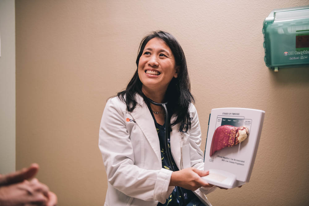 Dr. Kuang with a medical display