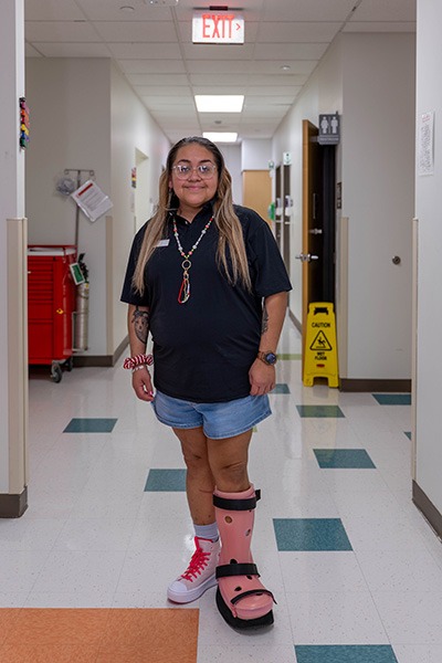 Danielle sporting a pink boot