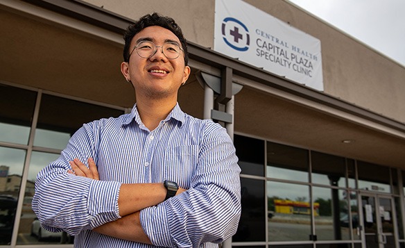 central health employee in front of building