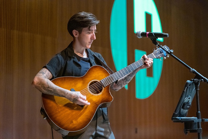 Kelsi Creek playing guitar