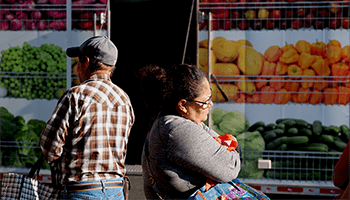 people in front of mobile pantry