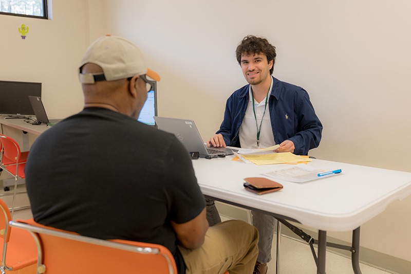 man with tax preparer