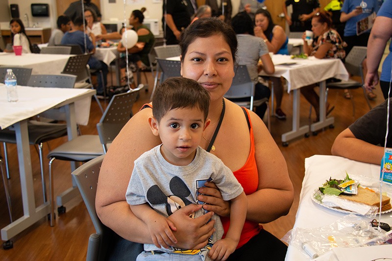 child and mother at lunch event
