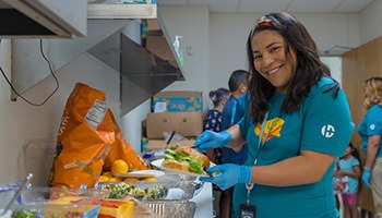 person preparing a lunch plate
