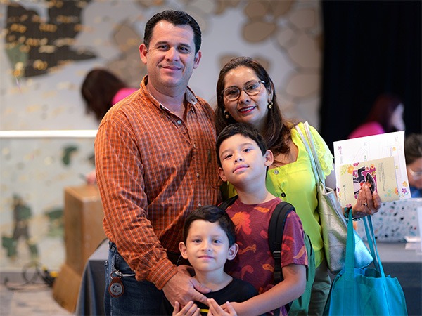 Family of four posing for a picture