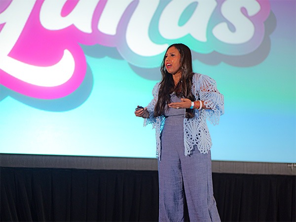 woman on stage speaking