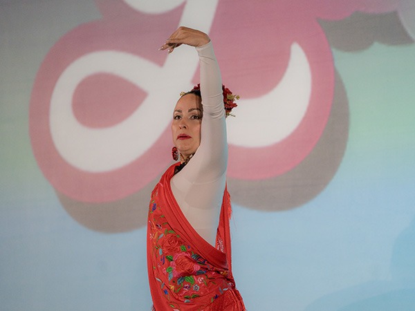woman on stage posing in a ballet position