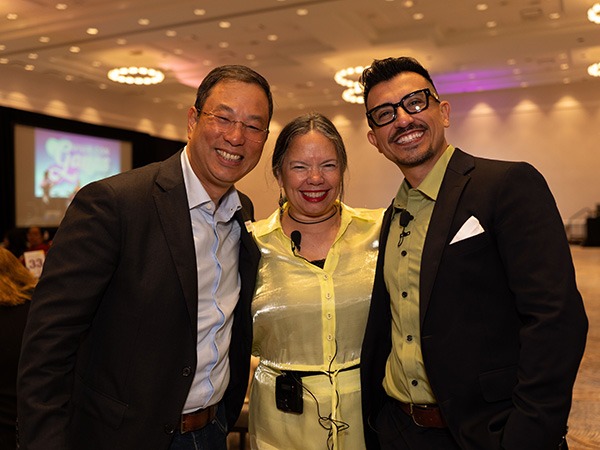 Three people posing for a picture